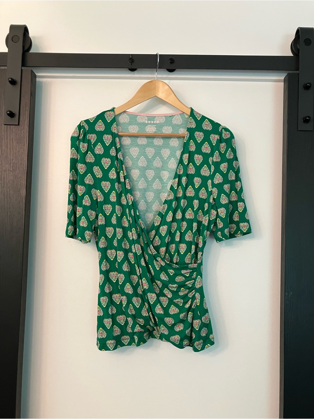 Boden Green Faux Wrap Top with Heart Medallion Print